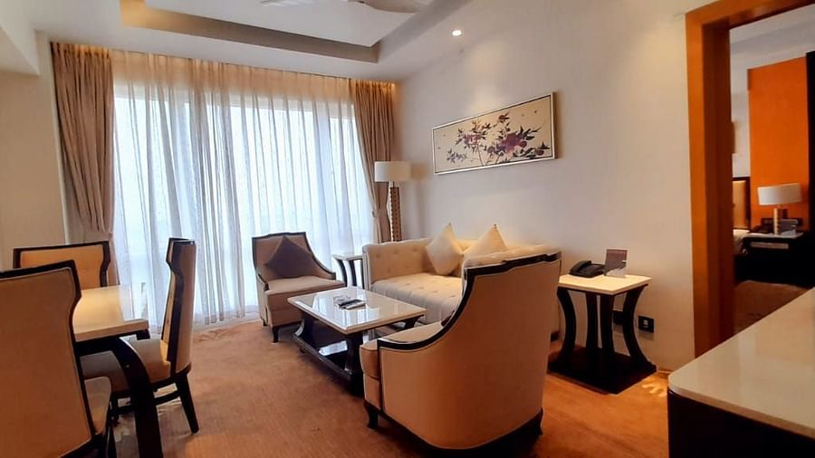 a view of the living room with comfortable sofas and TV of C-Suite at Wonder country club resort