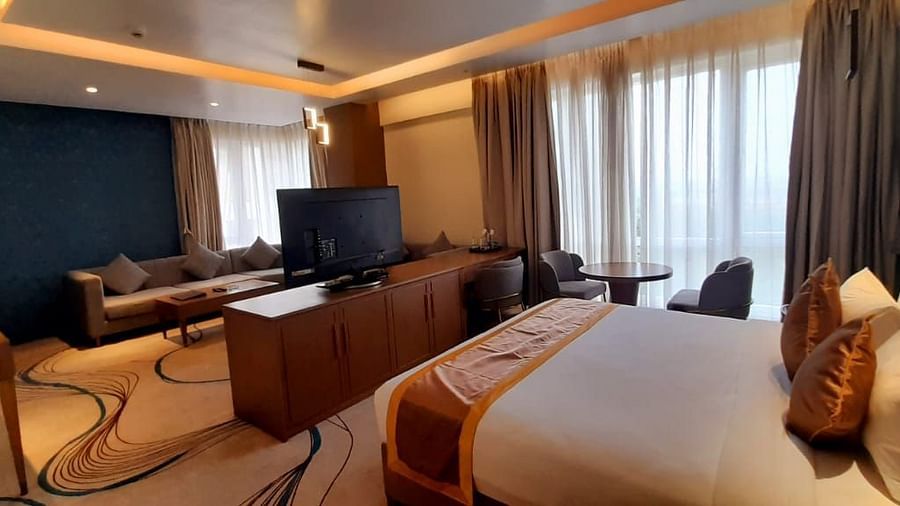 a view of the living room and the king size bed of M-Suite at Wonder country club resort
