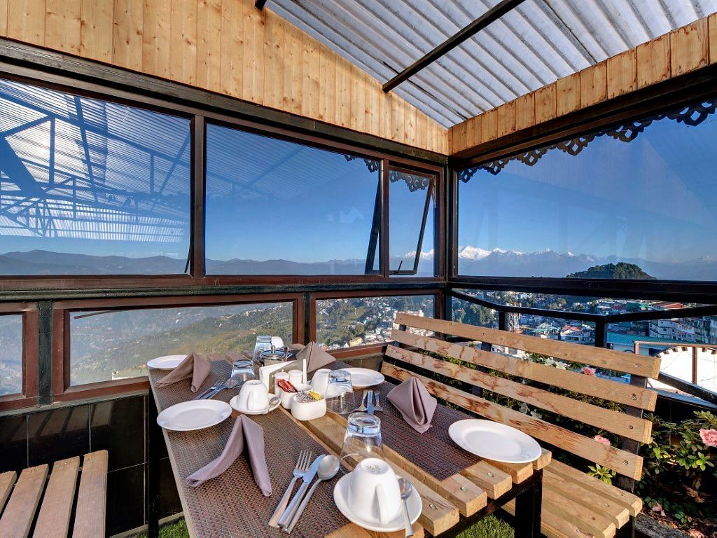 Restaurant of Sumitel Vista featuring seating area with table set up with cutlery