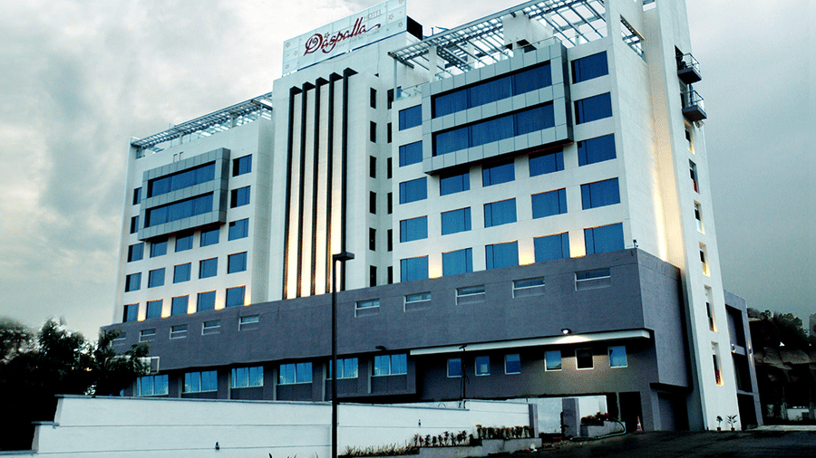 Daspalla Hotelexterior view from street showing tall white and grey building with large glass windows