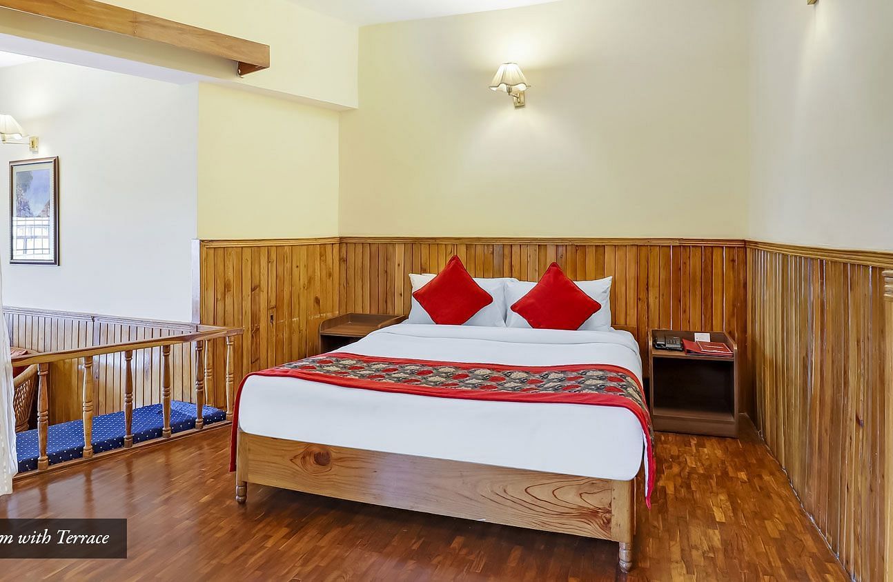 A front view of a bed in a room | Summit Newa Regency & Spa, Pelling
