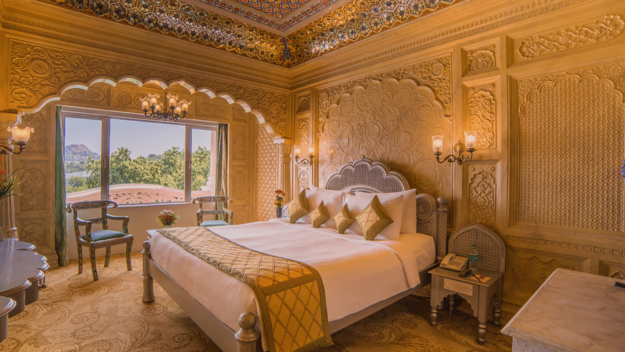 Room at Sitara Luxury Hotel in Hyderabad near Ramoji Film City with a double bed and side tables