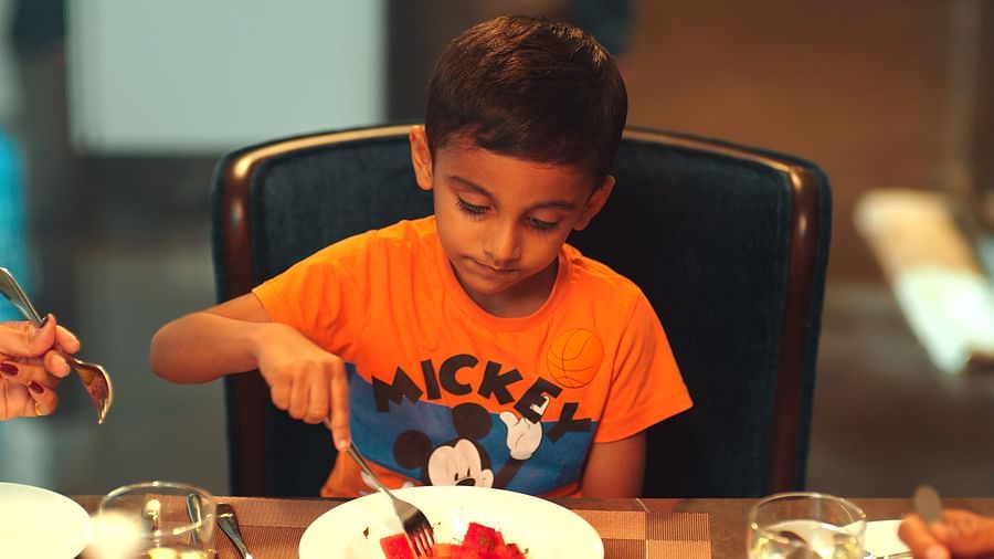 Kid enjoying dinner Golak Kumta