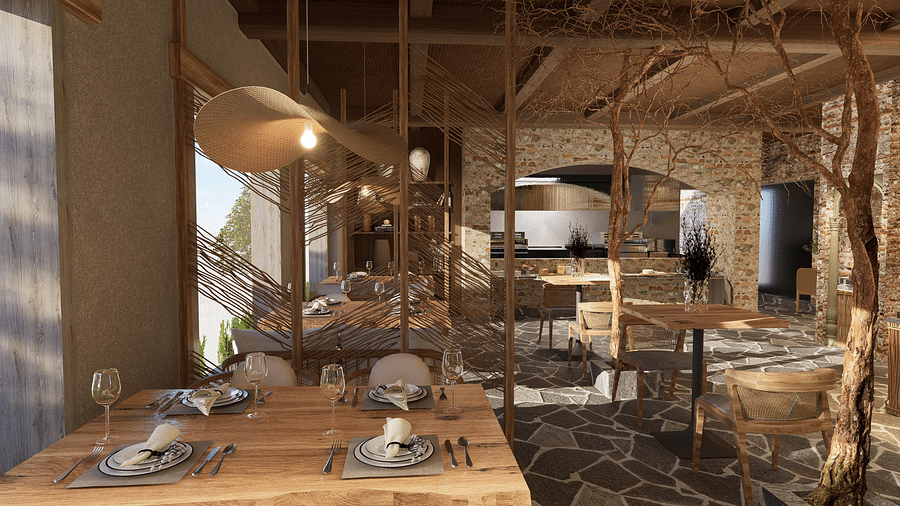 Wood-themed restaurant with branches and tables and chairs set for guests at The Evren, Vagator.