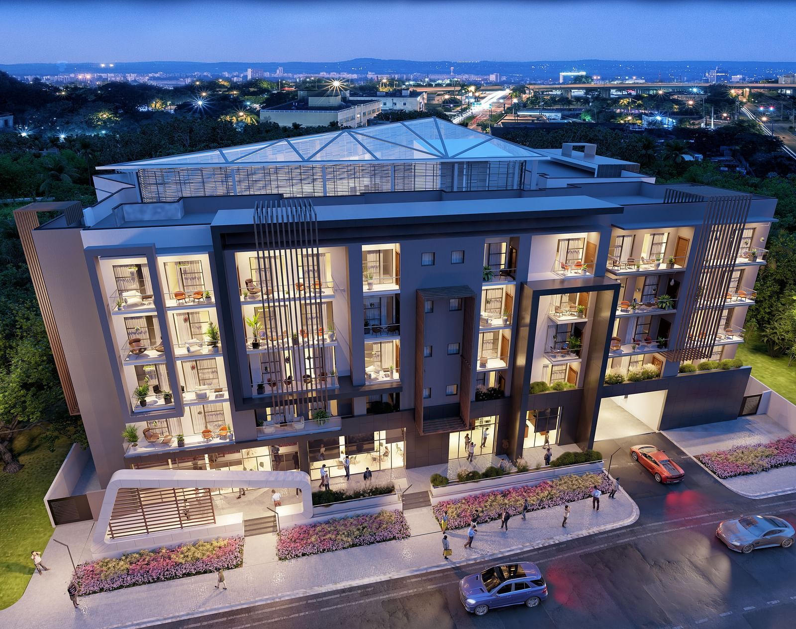 Aerial view of The Pelican Hotel, Accra during twilight with the lights on.