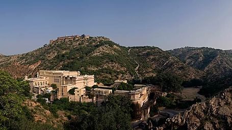A drone shot of Samode Palace seen from a hill top