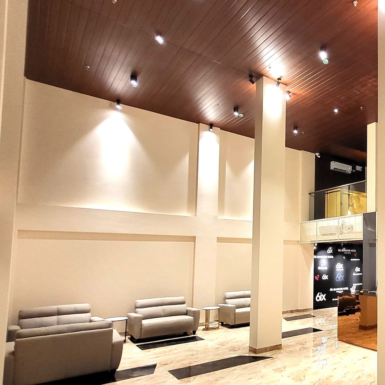 Wide view of the Lobby and the reception at 6ix Seashore Hotel, Port Blair