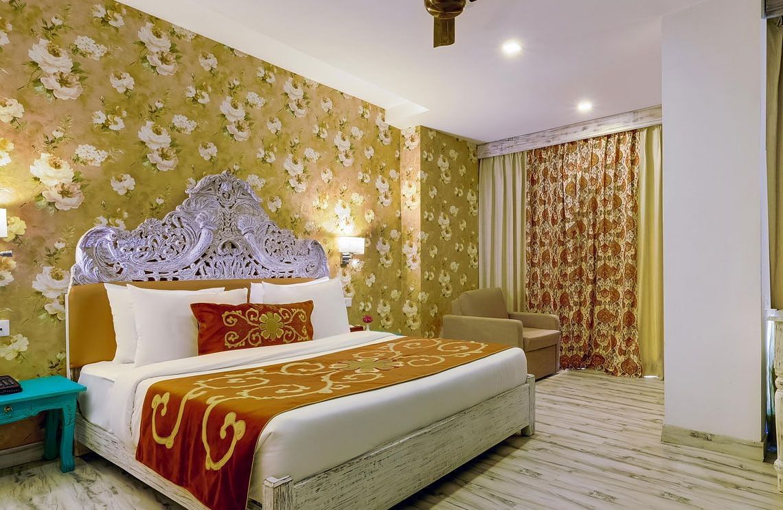 Image of a room wuth bed ans sitting area at Summit By The Ganges Beach Resort & Spa, Rishikesh
