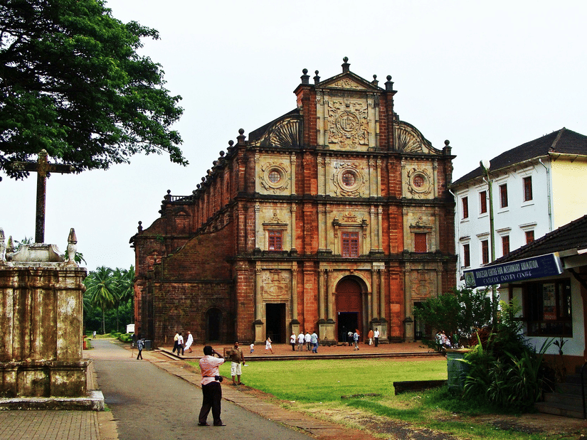 The exterior of the Basilica of Bom Jesus with a manicured garden in front of it. This church is one of the serene places to explore in South Goa.