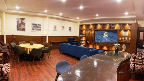 A modern lounge or bar area with a long counter and seating.