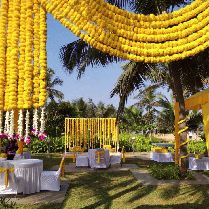 Vibrant floral decor for a ceremony at Azaya Beach Resort Goa, one of the top wedding resorts in Goa.