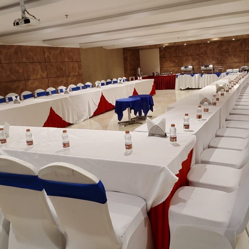 Terminal 01 Hall at Wonder Country Club and Resort, Kharagpur featuring U-shaped table and chair arrangement with elegant, stylish lighting