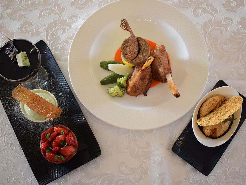 Buena Vista Luxury Garden Spa Resort - an overhead shot of a table full with three plates of food