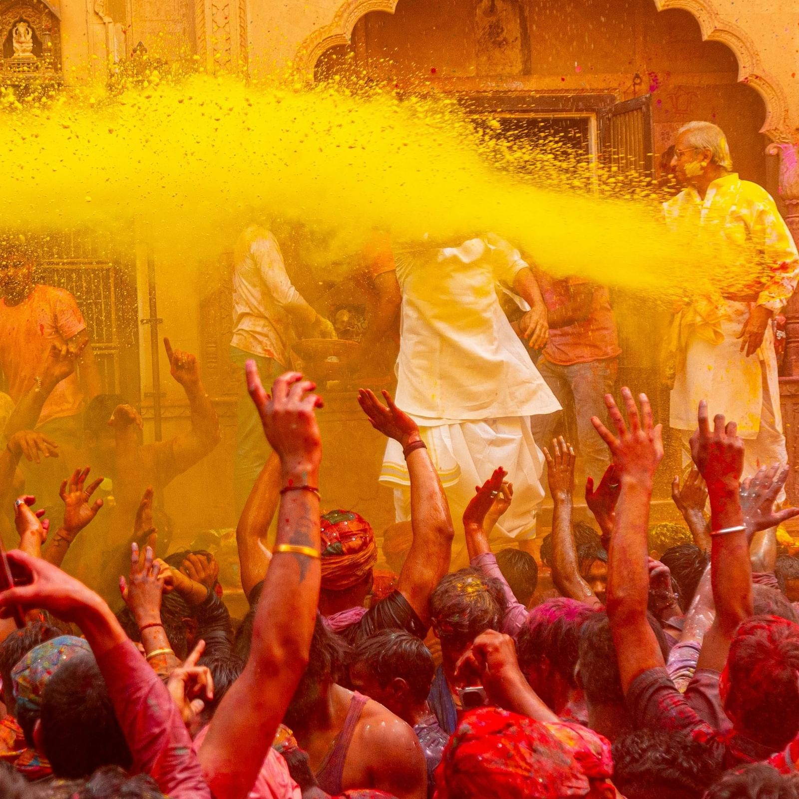 People immersed with several colours during holi festival.