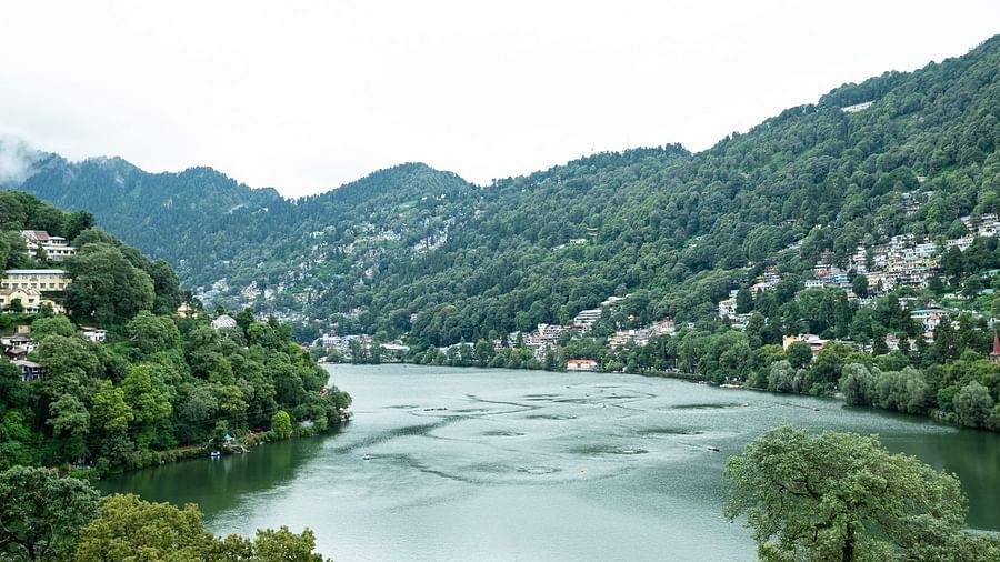 River view with lush greenery from hotel balcony at Himalaya Hotel, Nainital