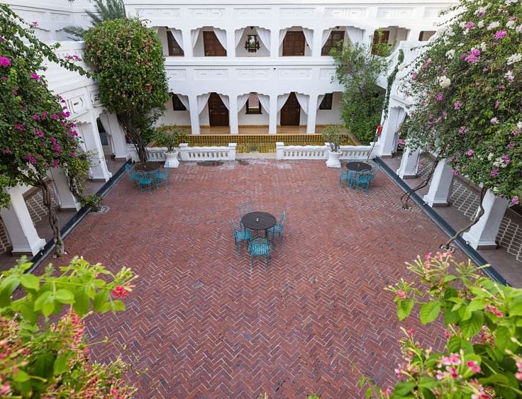 A view from the top of Saraca Hotel Lucknow of the hall Sehen with the courtyard in view