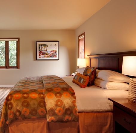 A spacious room in Mendocino with a big bed and scenic view from the window- Brewery Gulch Inn & Spa