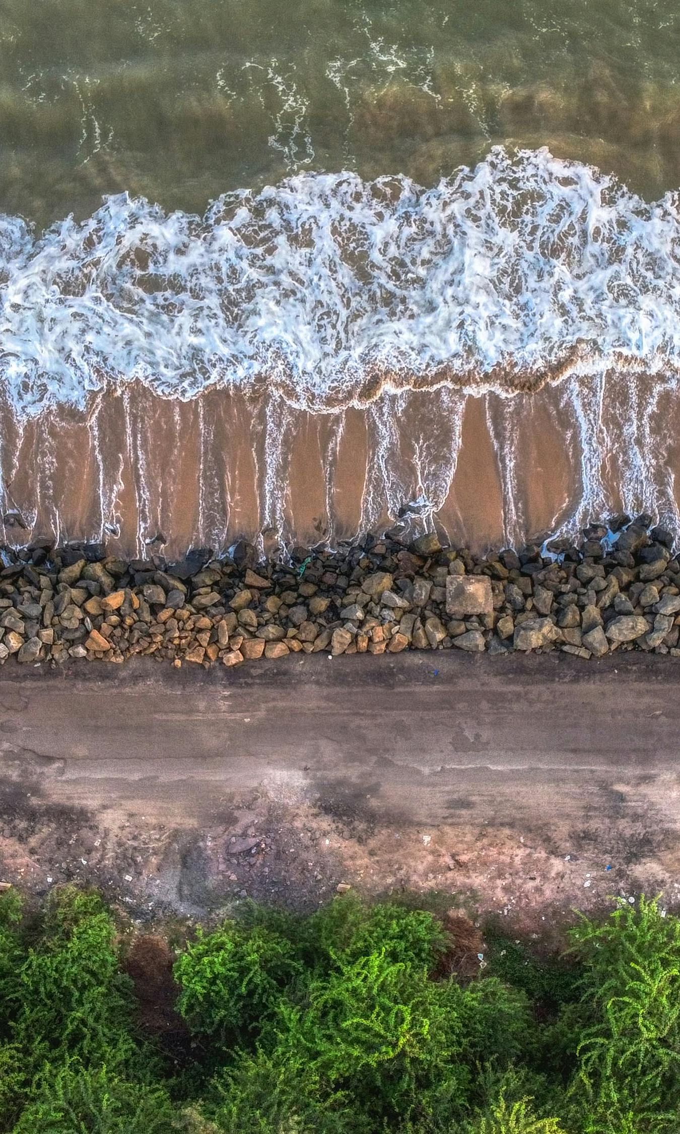 An image of Kakinada Beach with waves moving away from the shore