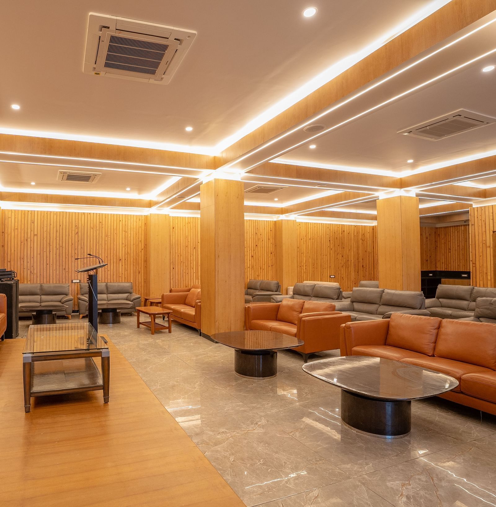 event hall with brown sofas at Summit Grand Resort & Spa