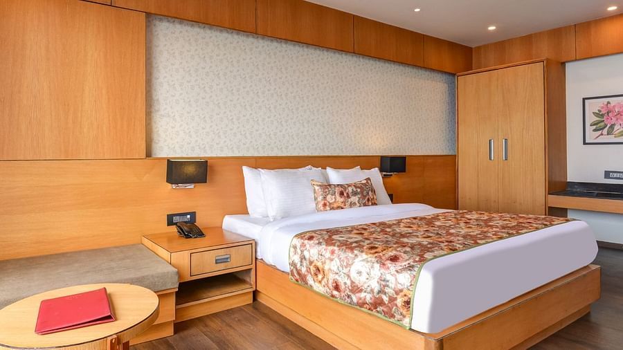 Presidential Suite with spacious twin beds and wall mounted televison along with large windows