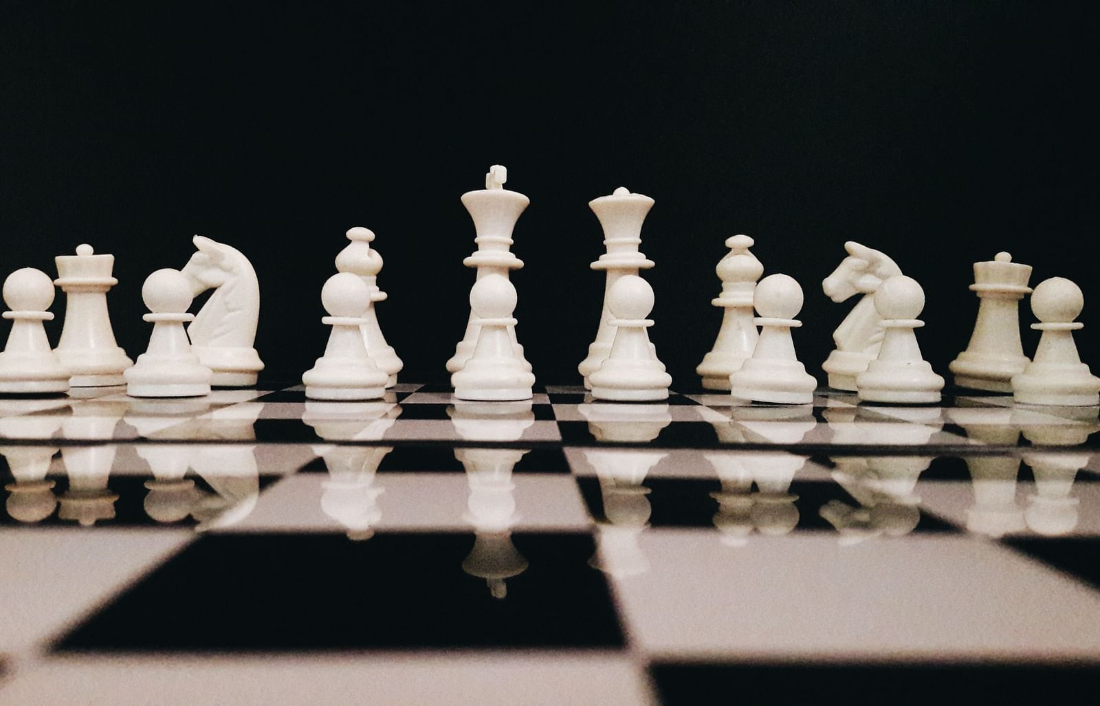 a chess board with the white pieces visible on the other end