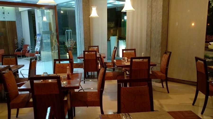 Dining setting of a restaurant at Regency Hotel, Mumbai.