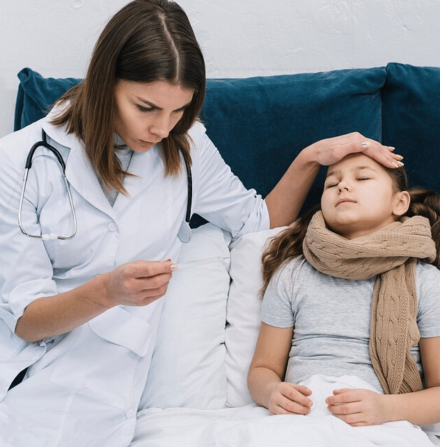 A doctor checking a child's forehead for fever