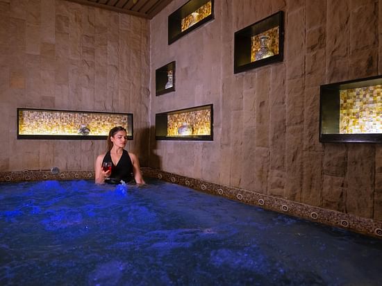 An image of a women inside a bathing tub -  The Manor Luxury Hotel, Shimla