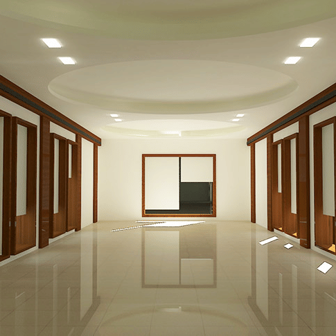 A well-lit Aqua Hall at Uday Samudra Leisure Beach Hotel, Kovalam, featuring polished floors, wooden panelling, recessed lighting, and a minimalistic design.