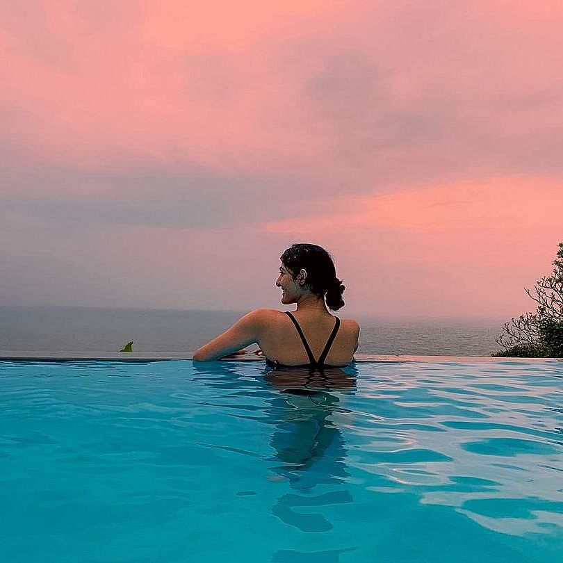 a woman chilling in the cintacor infinity pool