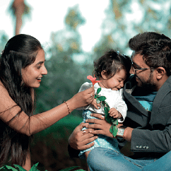 image of a family of three people with a toddler 