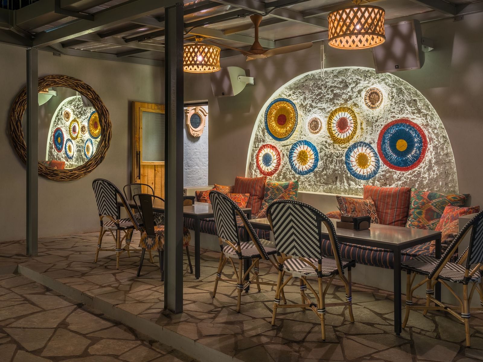 A minimalistic interior design with wooden light coverings and seating arrangements at Village 36