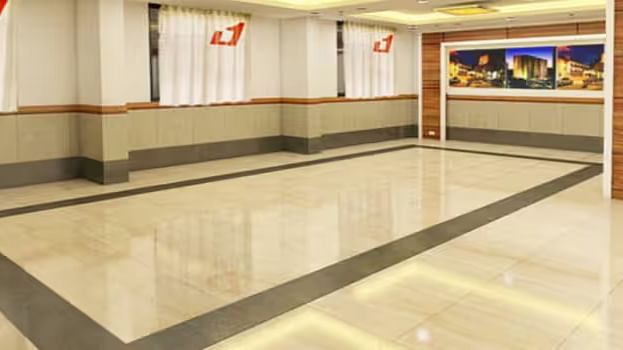View of banquet hall called The Durbar with polished flooring and ample space for events - Max Hotel Prayagraj.