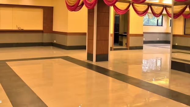 View of banquet hall called The Durbar with polished flooring and ample space for events - Max Hotel Prayagraj.