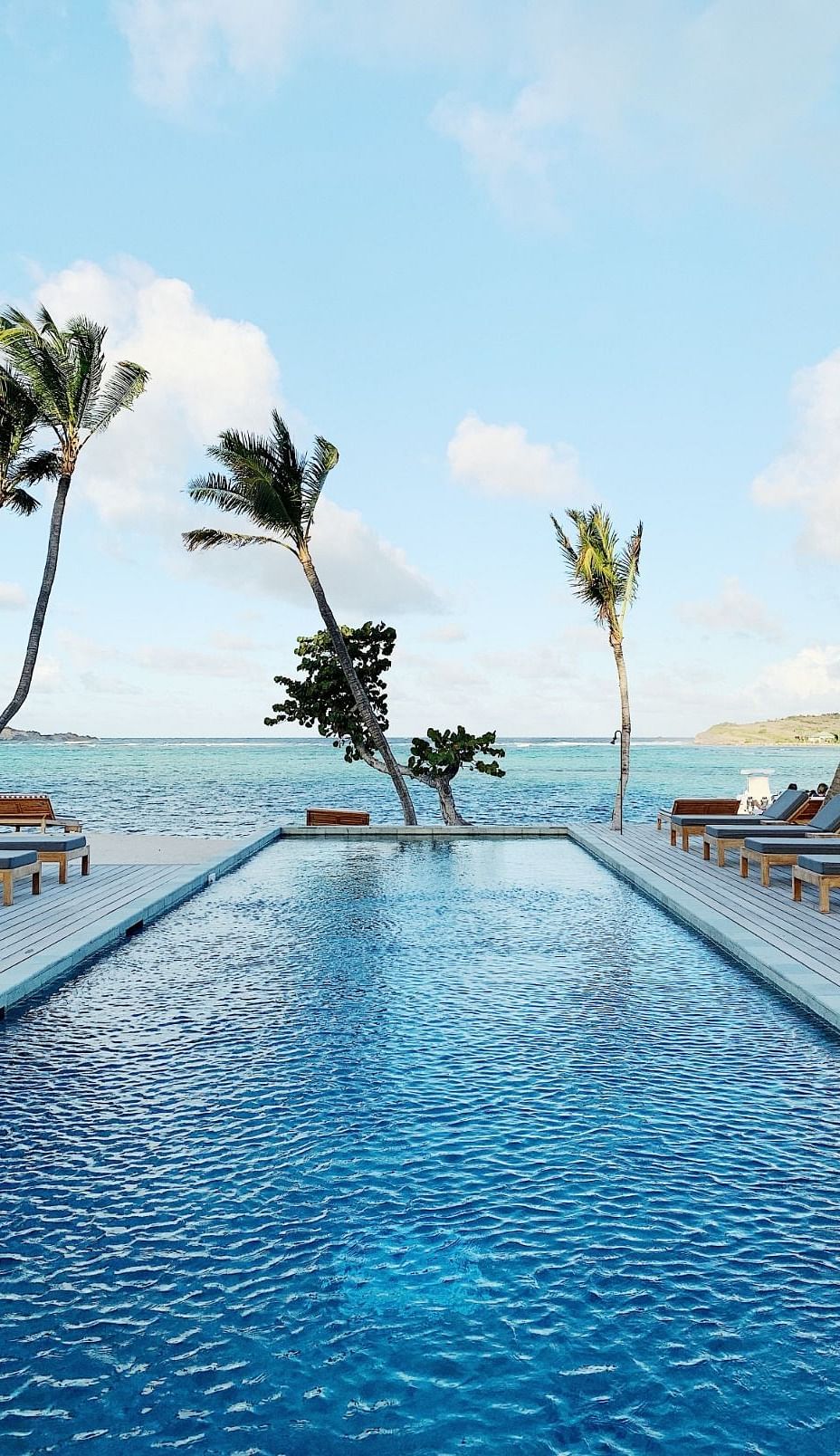 Infinity Swimming pool with the sea in the background at Ocean Spray, Puducherry