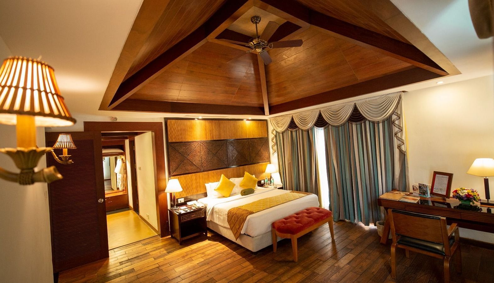 A beautiful interior with table lamp beside the bed at Ocean Spray, Puducherry