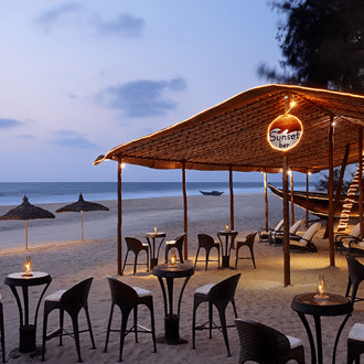 alfresco seating next to the beach at Sunset-Bar at Caravela Beach Resort - Restaurants in South Goa