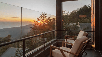 A balcony with two chairs which provides a sunset view | Kavya Resort and Spa, Nagarkot