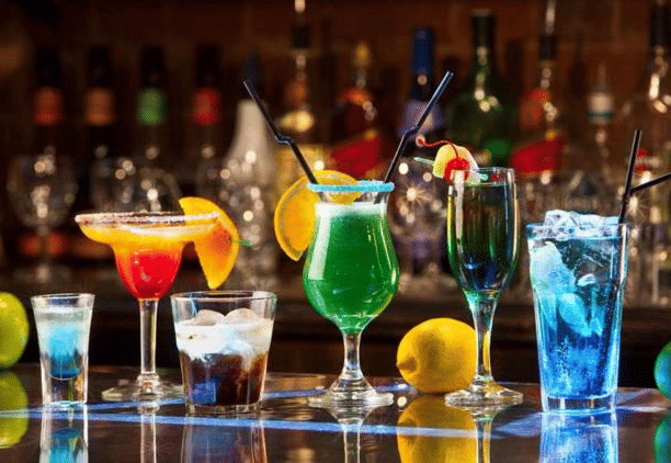 Image of a variety of drinks placed on a table at Coorg Jungle Camp Backwater Resort, Kushalnagar.