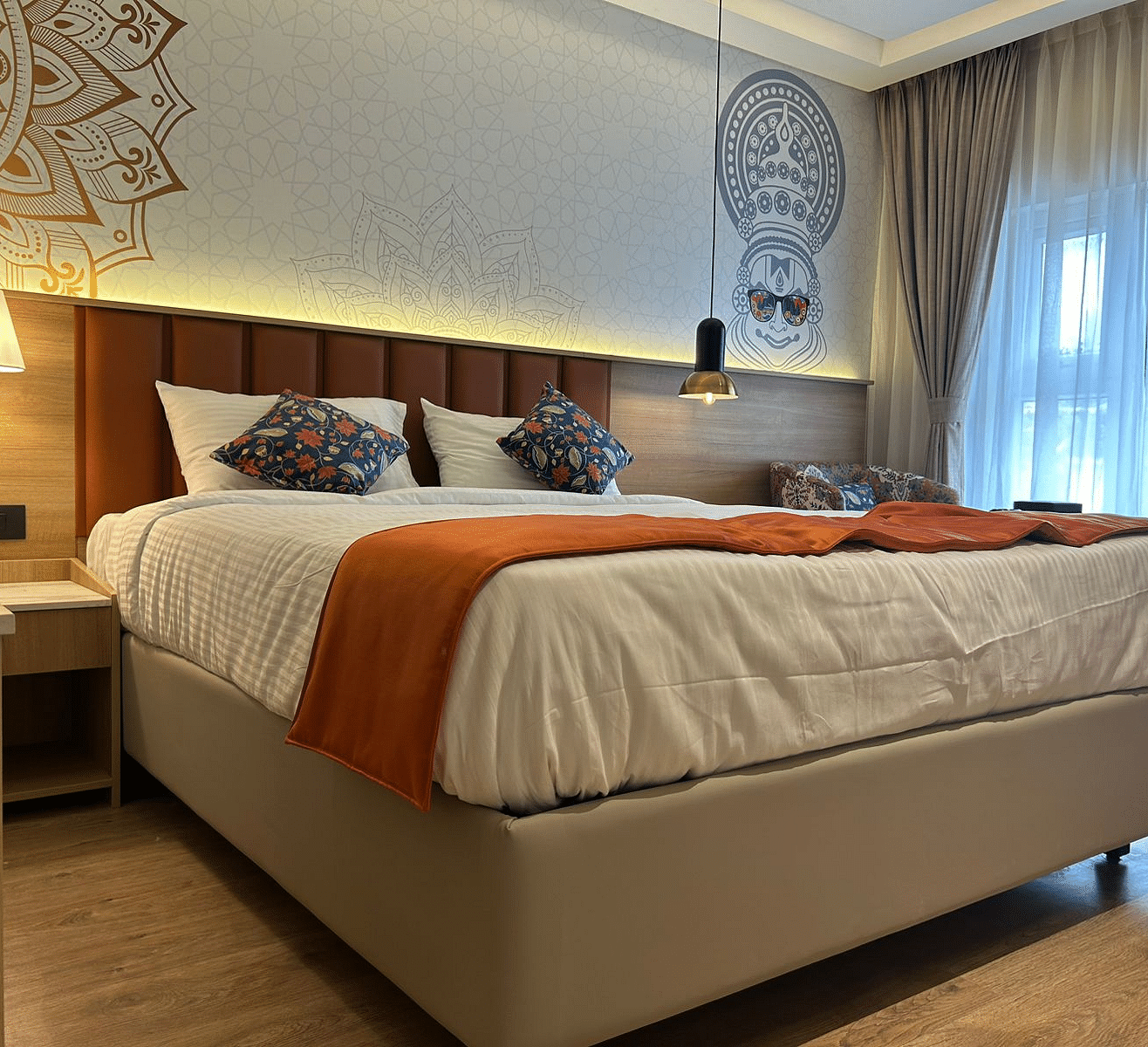A low angle shot of a room with a king size bed and other room amenities - TGI Oberon, Koramangala
