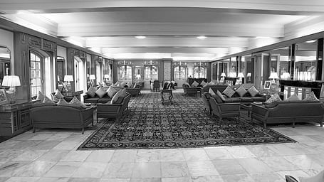 A black and white image of the hotel lobby in The Palace Hotel Bikaner