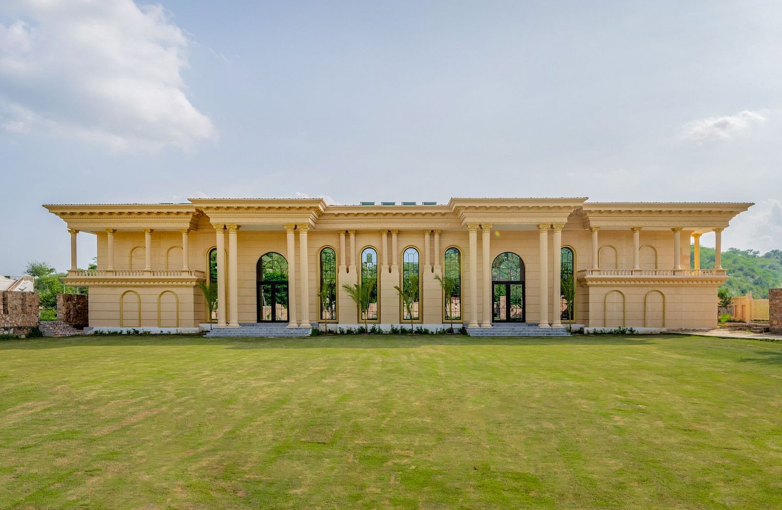 Facade of The Royal Know Banquet Hall at Valley by Grassfield, featuring large windows and a spacious open area in front.