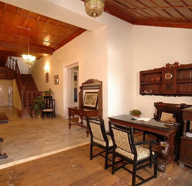 An mage of a well furnished rooms with wooden cabinets, cupboards, work desks, chairs,  etc. 