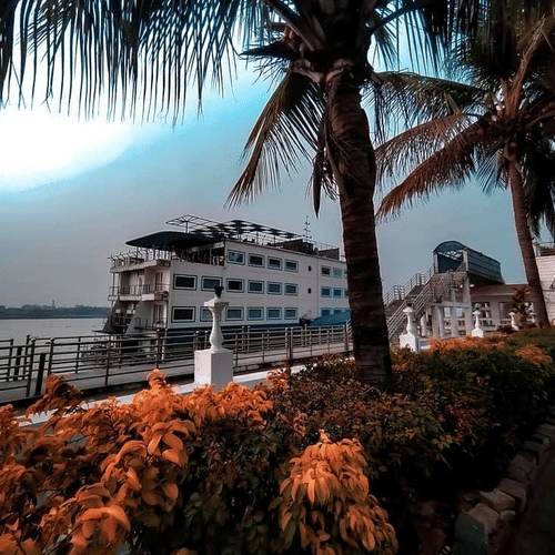 the exterior white facade of Polo Floatel, floating hotel in Kolkata during evening