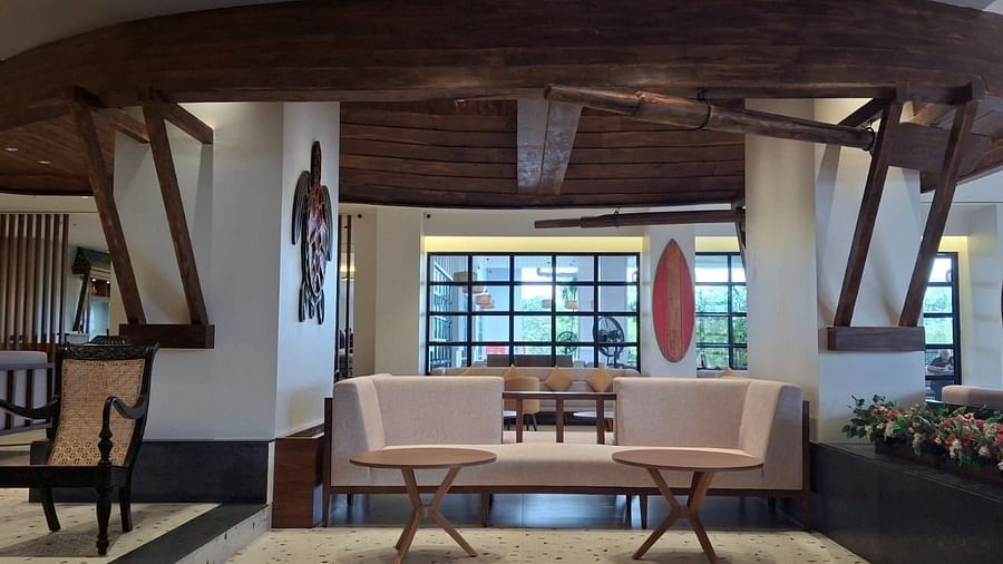 Chairs in a common area at Cloud9 Sarovar Premiere, Goa, offering a comfortable space for guests to relax and unwind