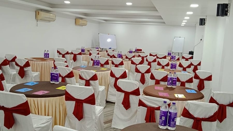 Round tables and chairs covered with cloth, and warm overhead lighting enhance and reside in the Emerald banquet hall of Mountview Resort.