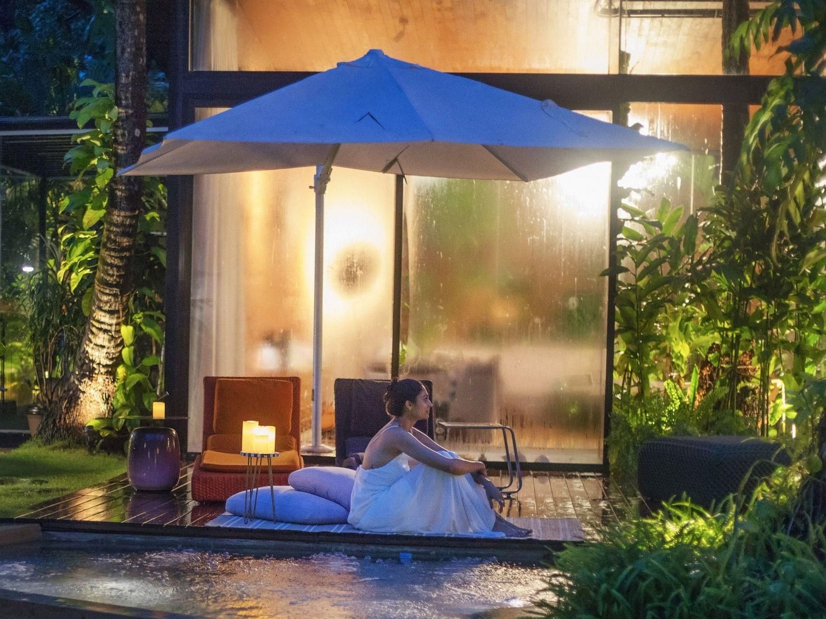 Private poolside relaxation at a tropical villa during monsoon