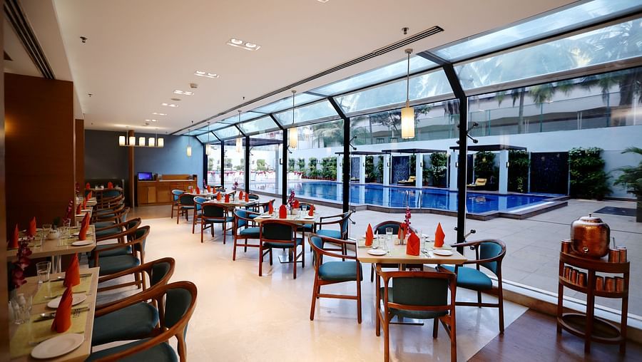 seating area overlooking the pool at Cascades restaurant in Vizag