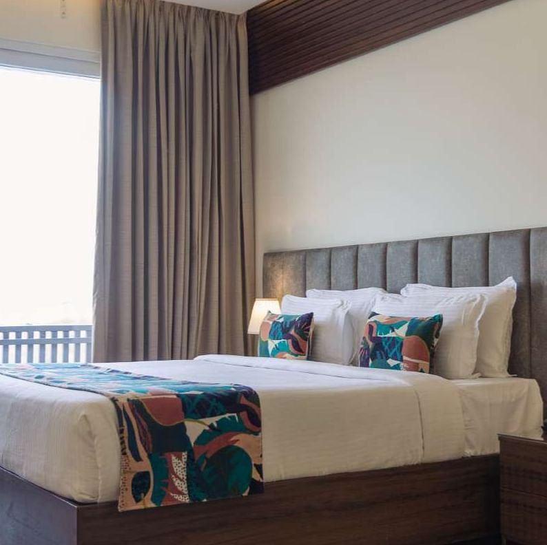 premium palace view  room with king sized bed and TV at Aura Boutique Hotel, Udaipur
