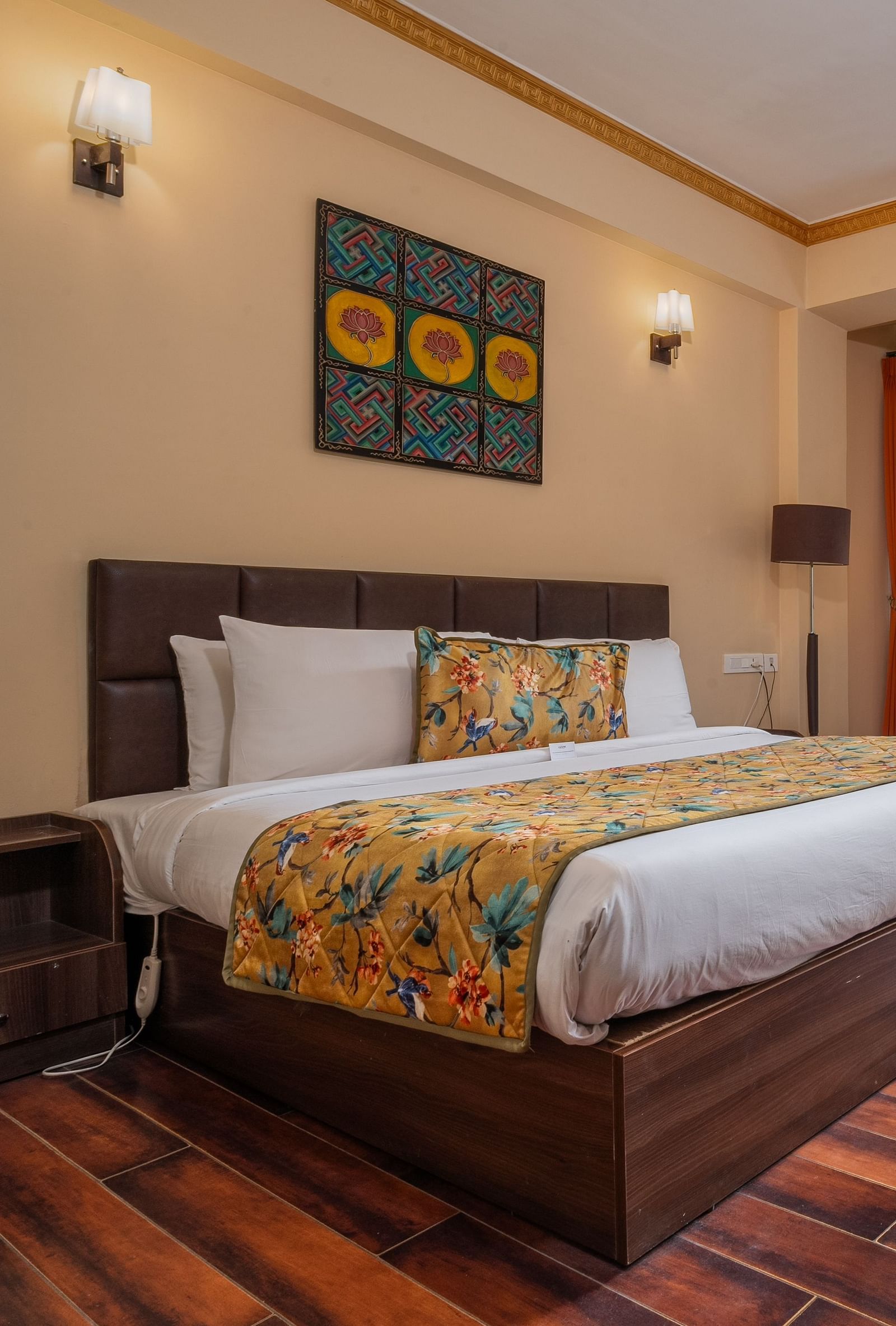 Premium room with balcony, featuring a stunning view, spacious bed, bedside table, reading table, and chair at Summit Norling Resort & Spa, Gangtok